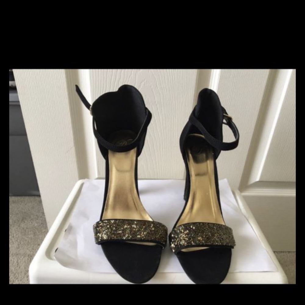 Black heels with gold beaded band